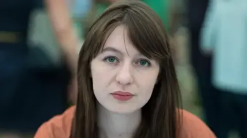 Sally Rooney states she is unable to enter the UK due to legal concerns