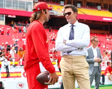 The NFL legend sparks social media outrage as being spotted in Raiders coaching booth